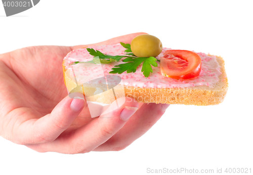 Image of man holding delicious toast