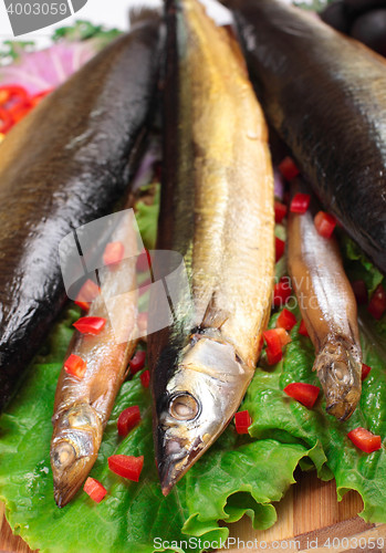 Image of fish on plate with red pepper