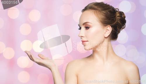 Image of smiling young woman face and shoulders