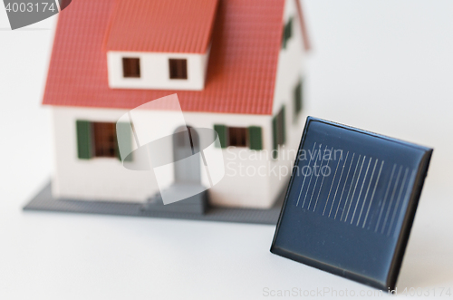 Image of close up of house model and solar battery or cell