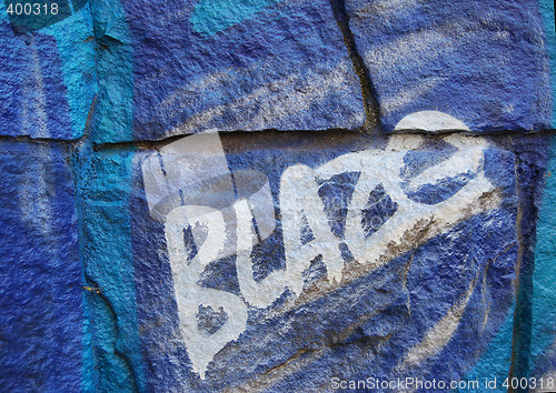 Image of blue grafitti with tag