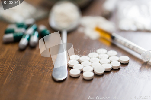 Image of close up of drugs, money, spoon and syringe