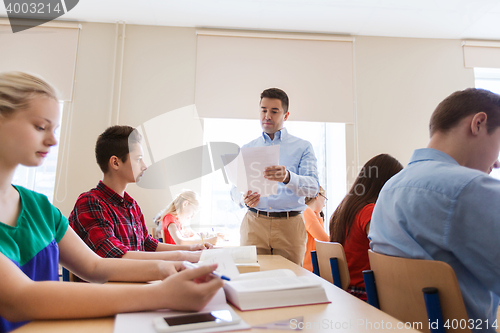 Image of group of students and teacher with test results