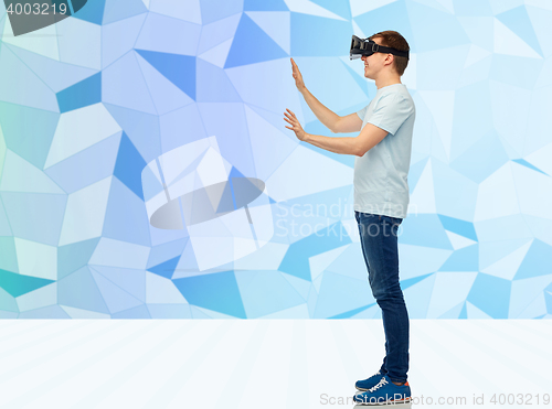 Image of happy man in virtual reality headset or 3d glasses