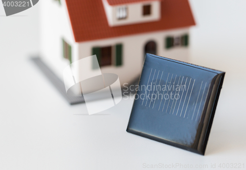 Image of close up of house model and solar battery or cell