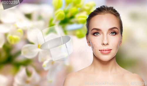 Image of beautiful young woman face over white background