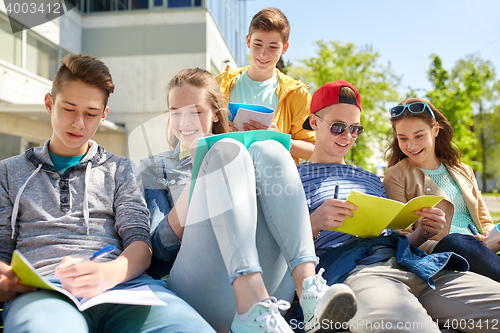 Image of group of students with notebooks at school yard