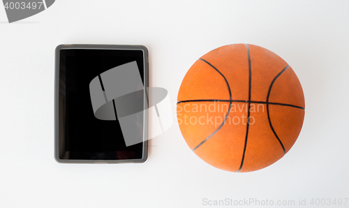 Image of close up of basketball ball and tablet pc computer
