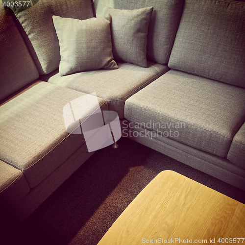 Image of Gray corner sofa and wooden coffee table