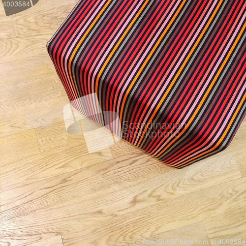 Image of Striped cube chair on wooden floor