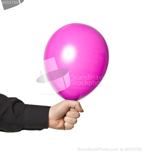 Image of hand holding baloonn