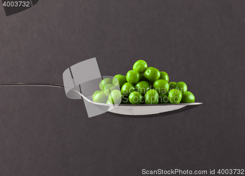 Image of fresh frozen peas on spoon