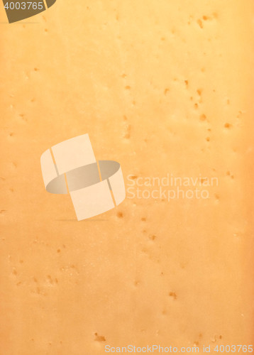 Image of Background of fresh yellow Swiss cheese with holes