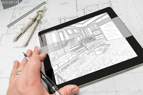 Image of Hand of Architect on Computer Tablet Showing Kitchen Illustratio