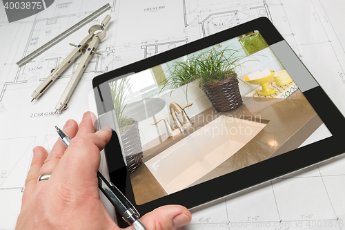Image of Hand of Architect on Computer Tablet Showing Bathroom Details Ov