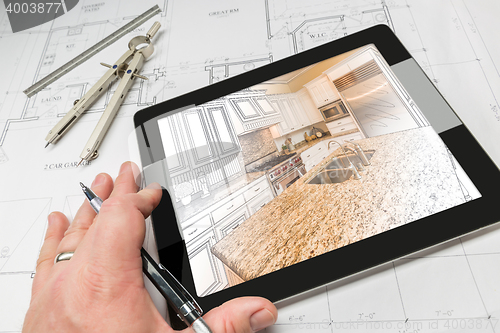 Image of Hand of Architect on Computer Tablet Showing Kitchen Illustratio