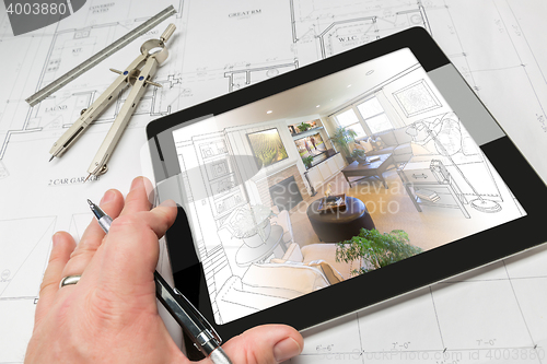 Image of Hand of Architect on Computer Tablet Showing Living Room Over Ho