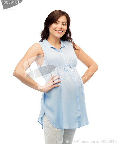 Image of happy pregnant woman touching her big belly