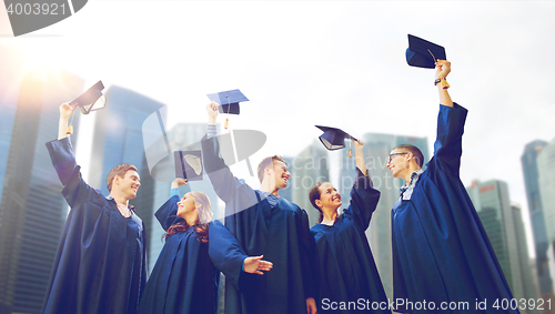 Image of group of smiling students with mortarboards