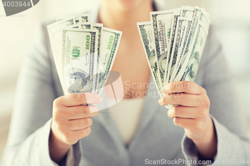 Image of close up of woman hands holding us dollar money