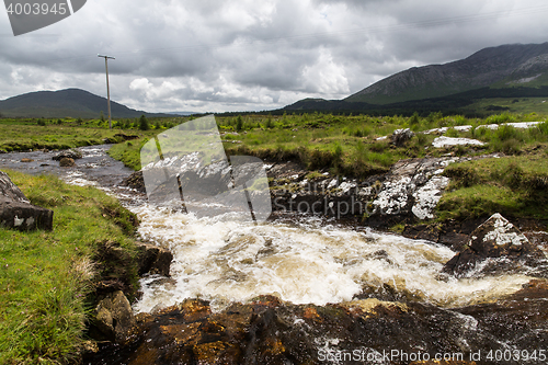 Image of view to river and hills at connemara in ireland