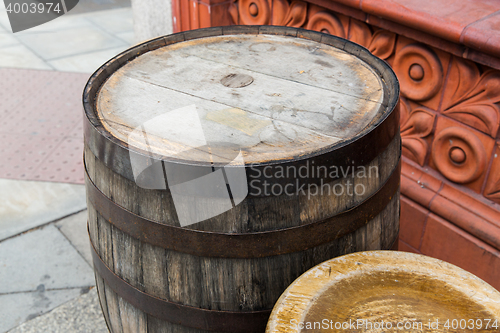 Image of close up of old wooden barrel table outdoors