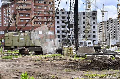 Image of  Construction site with cranes on sky background