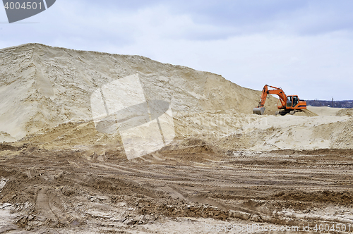 Image of Working digger in a quarry produces sand