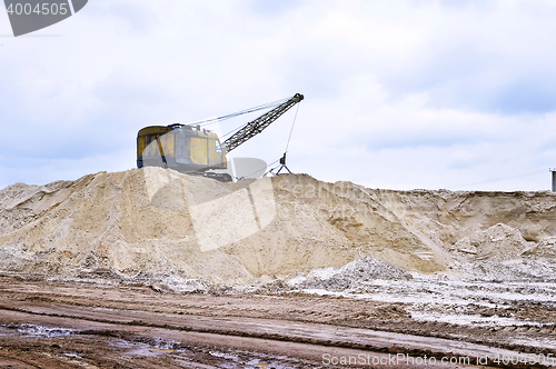 Image of Working digger in a quarry produces sand