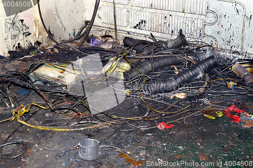 Image of Metal waste contaminated with oil, lay on the floor in the workplace