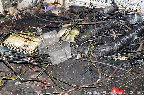 Image of Metal waste contaminated with oil, lay on the floor in the workplace