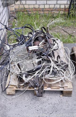 Image of Metal waste, lie on a wooden pallet warehouse on the open industrial waste