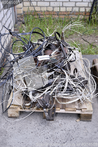 Image of Metal waste, lie on a wooden pallet warehouse on the open industrial waste