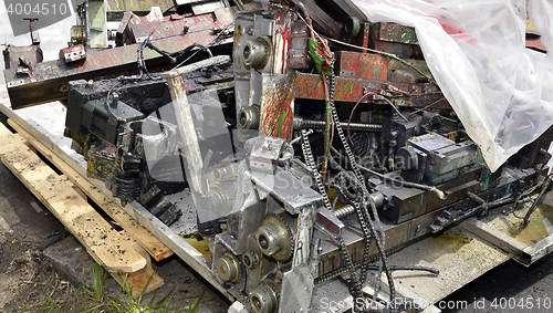 Image of Metal waste, lie on a wooden pallet warehouse on the open industrial waste