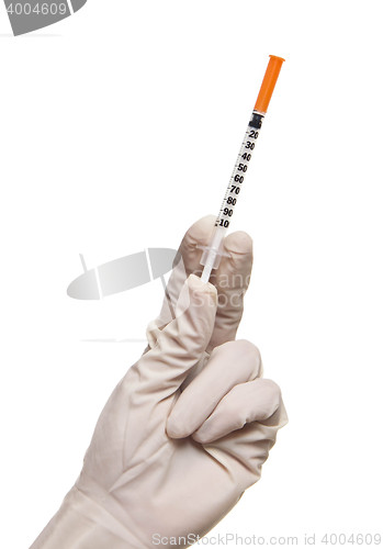 Image of Hand holding syringe isolated on white