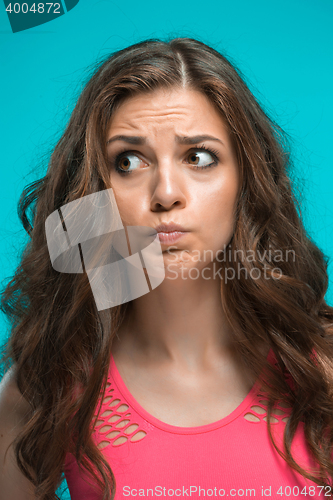 Image of Portrait of young woman with shocked facial expression