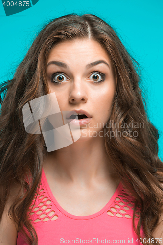 Image of Portrait of young woman with shocked facial expression