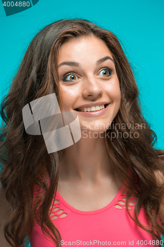 Image of Portrait of young woman with shocked facial expression