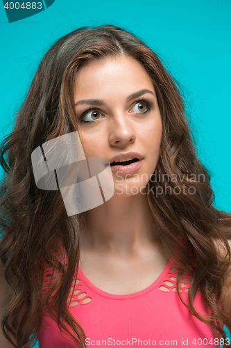 Image of Portrait of young woman with shocked facial expression