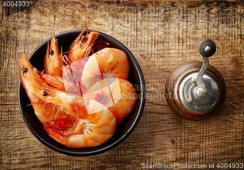 Image of roasted prawns on wooden cutting board