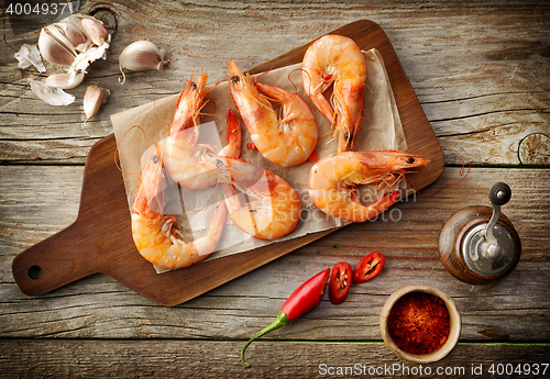 Image of roasted prawns on wooden cutting board