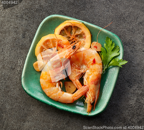 Image of roasted prawns on green plate