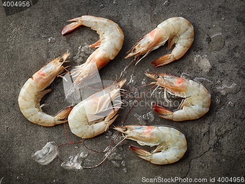 Image of fresh raw prawns on dark gray kitchen table