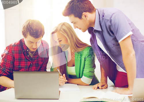 Image of students writing test or exam in lecture at school