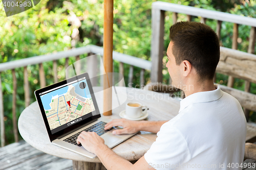 Image of close up of businessman with laptop on terrace