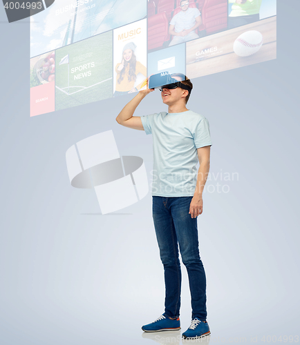 Image of happy man in virtual reality headset or 3d glasses