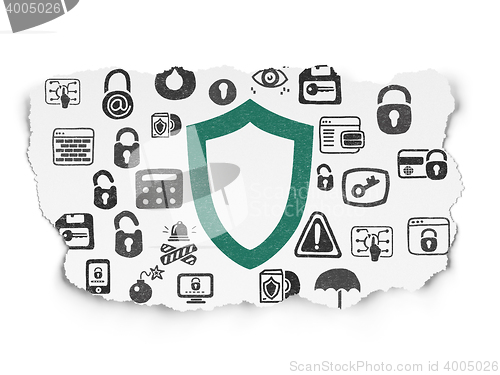 Image of Security concept: Contoured Shield on Torn Paper background