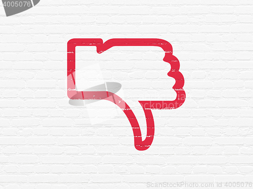 Image of Social media concept: Thumb Down on wall background