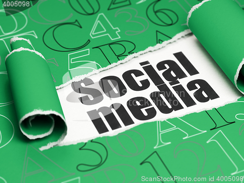 Image of Social network concept: black text Social Media under the piece of  torn paper