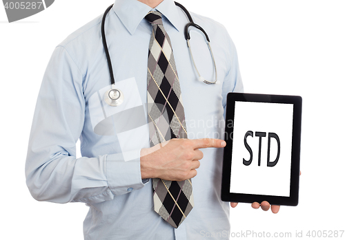 Image of Doctor holding tablet - STD